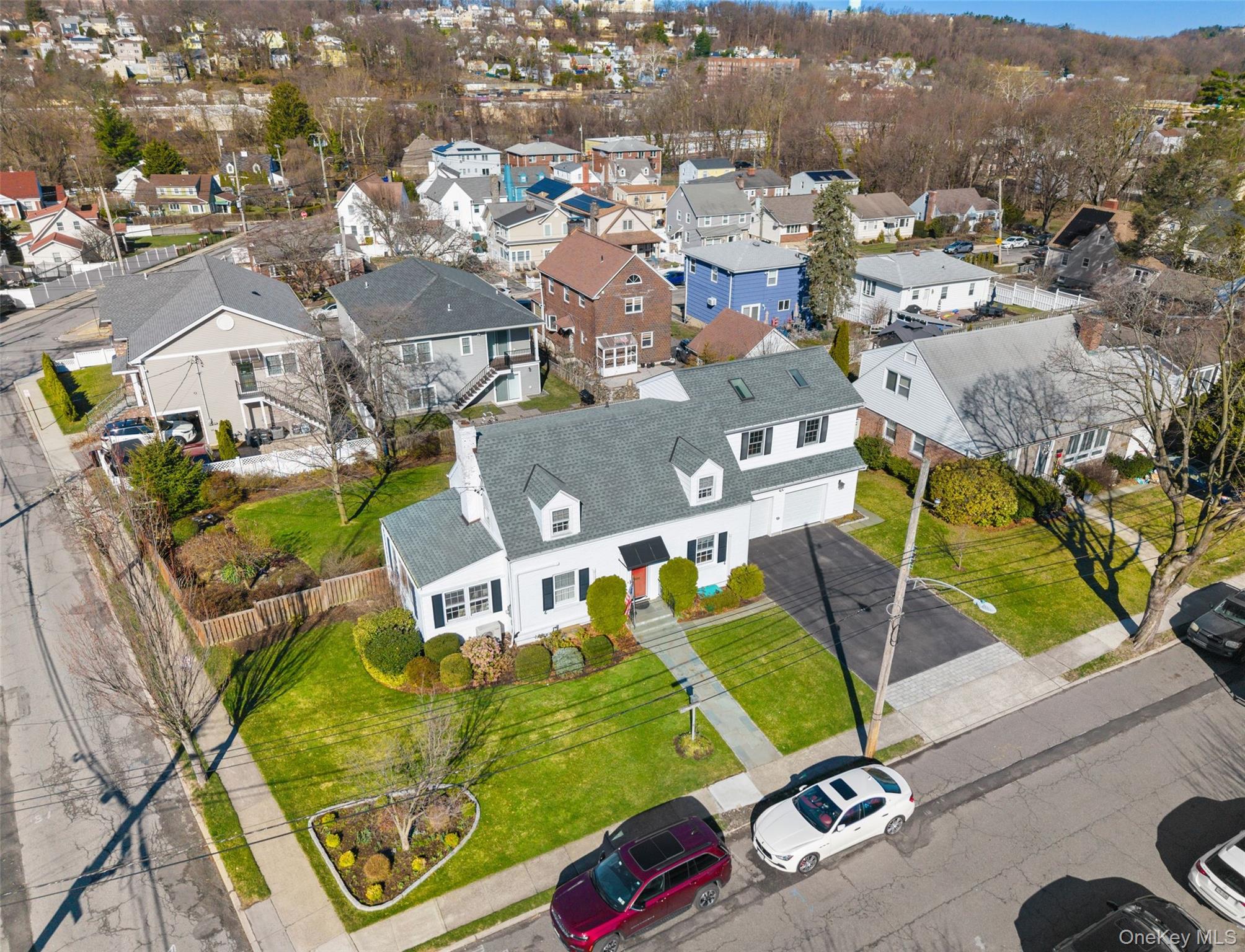 1 Hoover Road Yonkers, NY 10710 - Photo 2 of 50 an aerial view of a house with a swimming pool and mountains