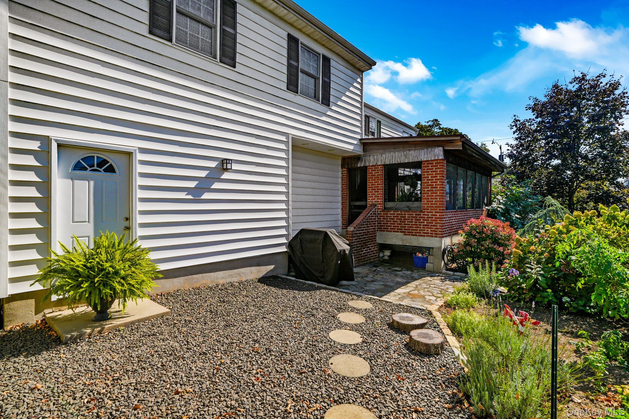 1 Hoover Road Yonkers, NY 10710 - Photo 24 of 50 a front view of a house with garden