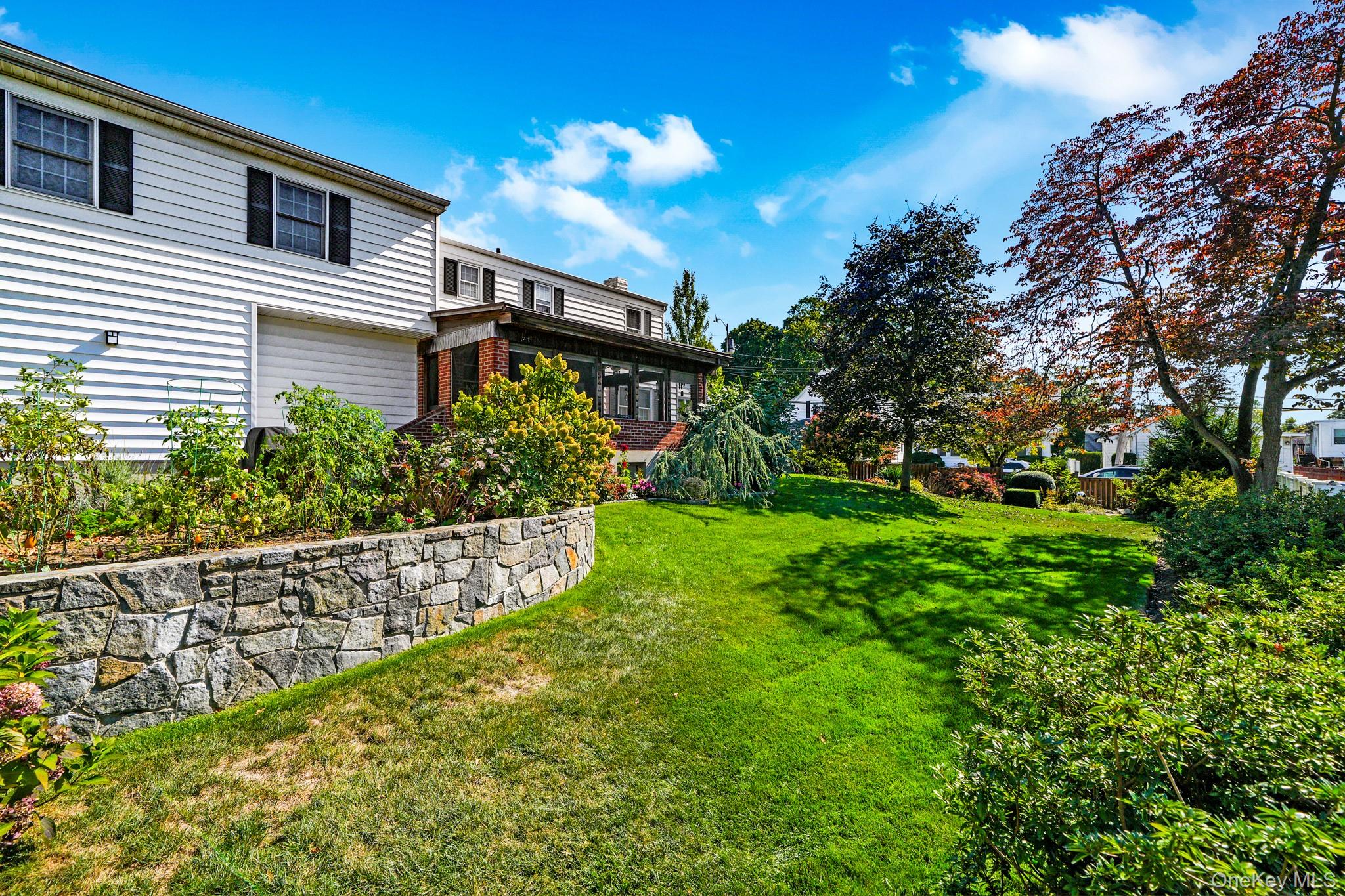 1 Hoover Road Yonkers, NY 10710 - Photo 28 of 50 a front view of a house with garden