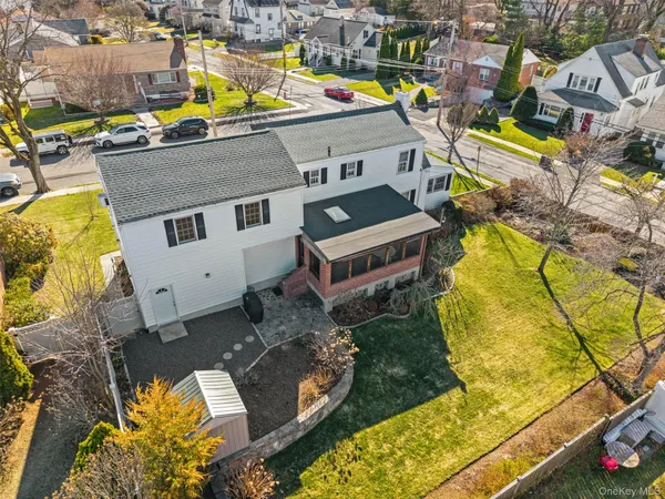 an aerial view of a house with a swimming pool