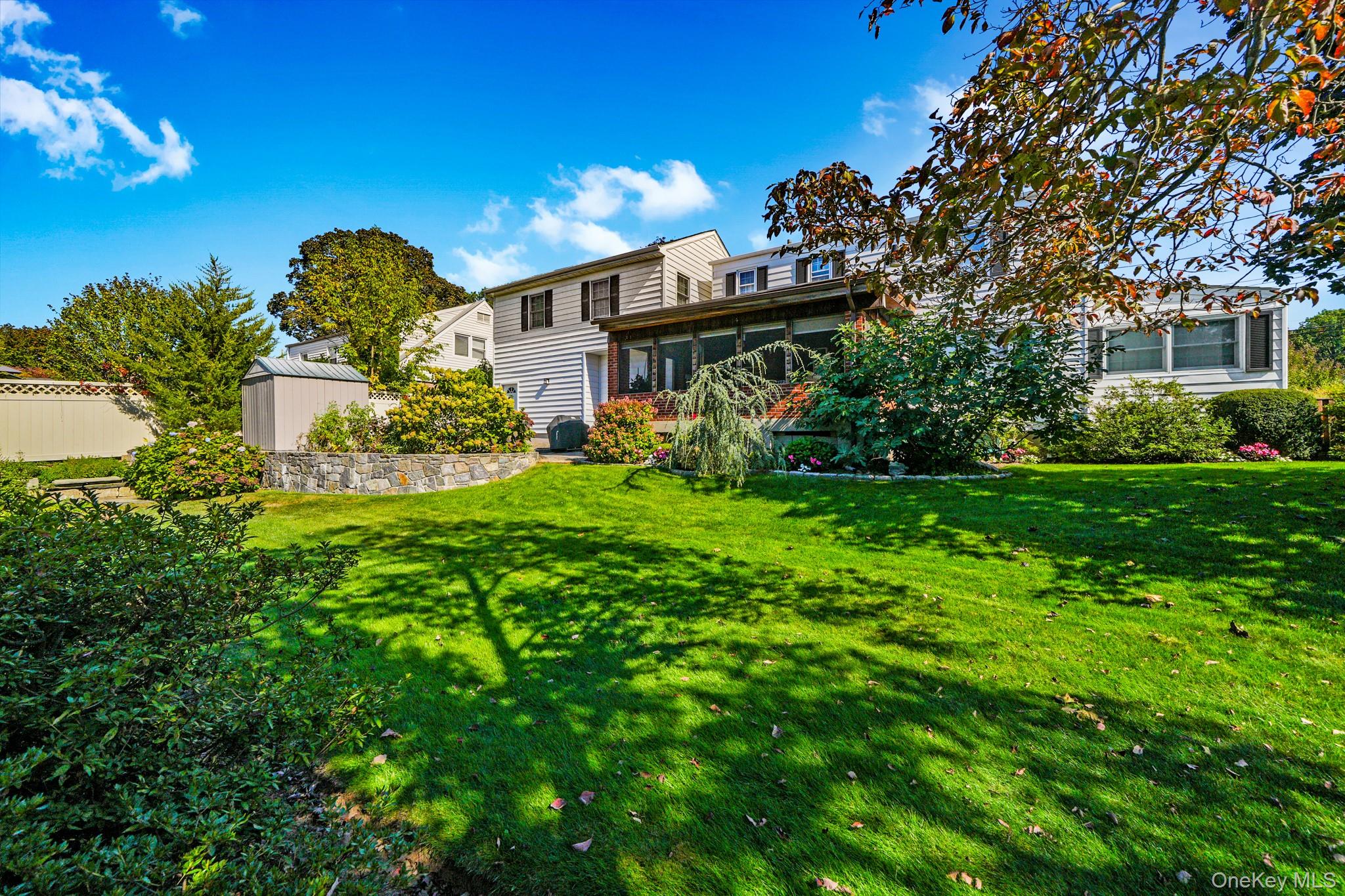 1 Hoover Road Yonkers, NY 10710 - Photo 32 of 50 a view of a house with a big yard plants and large trees