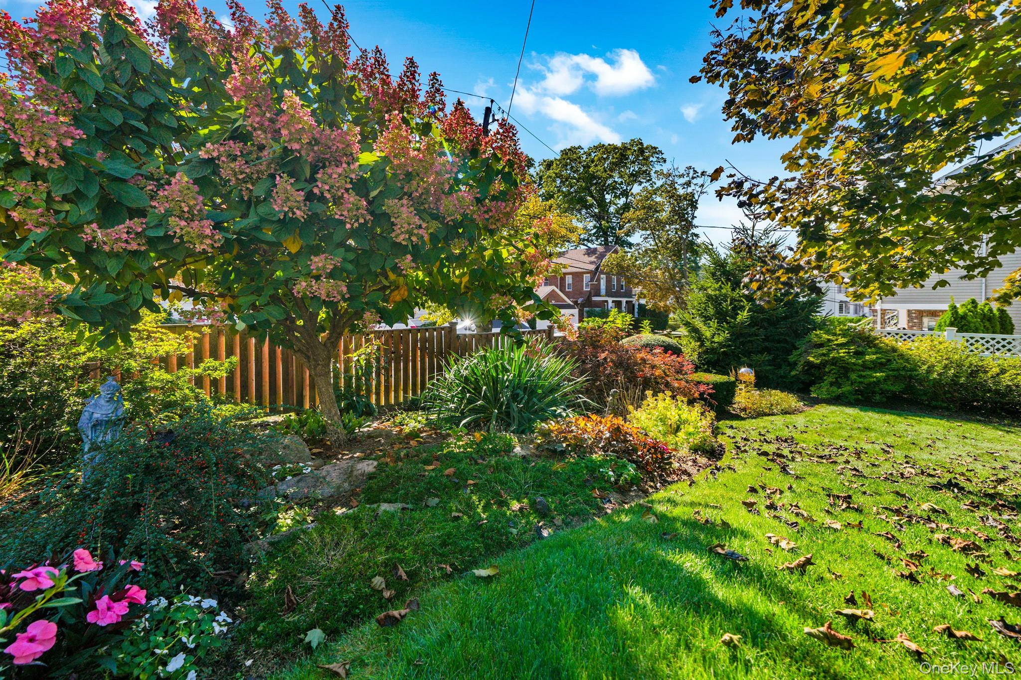 1 Hoover Road Yonkers, NY 10710 - Photo 37 of 50 a view of a garden with plants and large trees