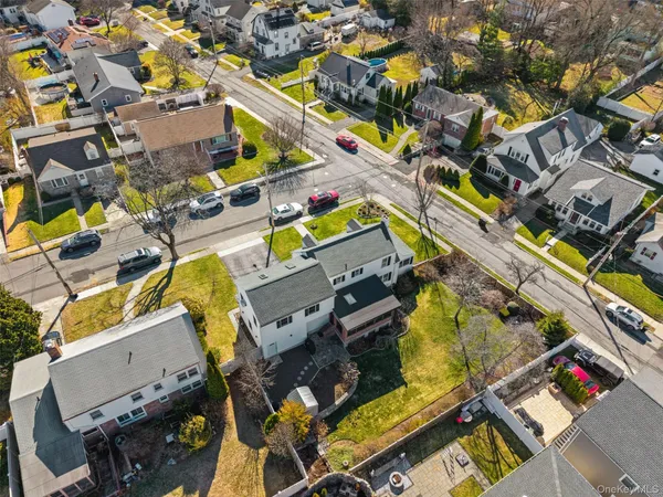 an aerial view of a house with a swimming pool
