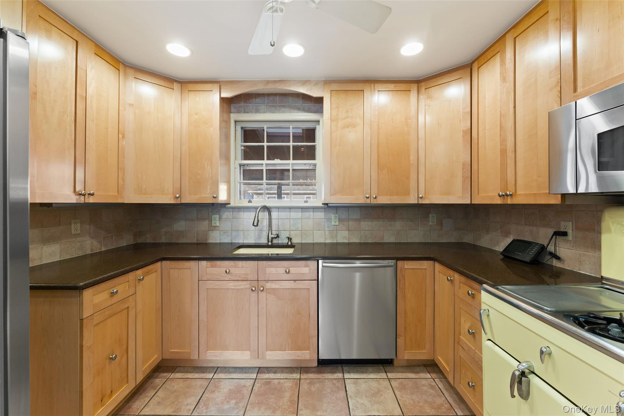 1 Hoover Road Yonkers, NY 10710 - Photo 8 of 50 a kitchen with stainless steel appliances granite countertop a sink and cabinets