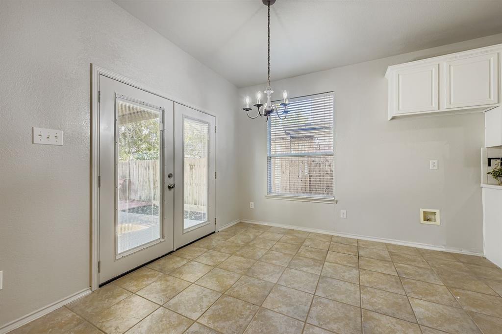 4201 Broken Bend Boulevard Fort Worth, TX 76244 - Photo 13 of 34 a view of an empty room with window and chandelier fan