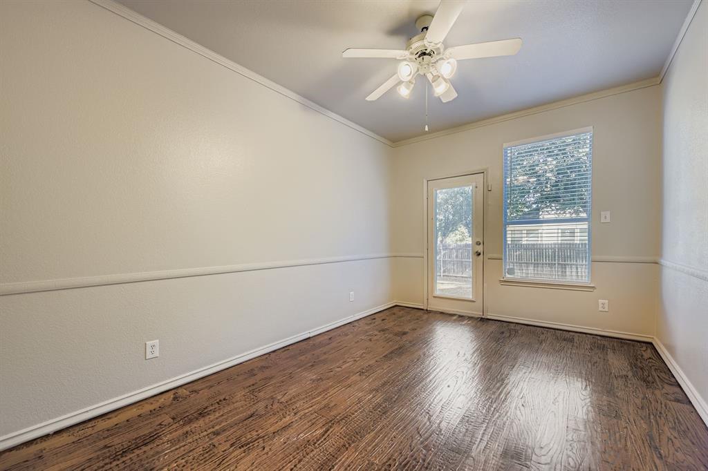 4201 Broken Bend Boulevard Fort Worth, TX 76244 - Photo 19 of 34 an empty room with wooden floor fan and windows