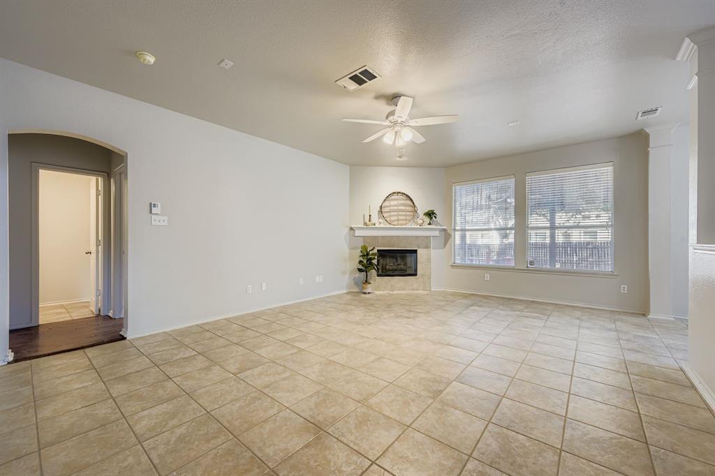 4201 Broken Bend Boulevard Fort Worth, TX 76244 - Photo 6 of 34 a view of empty room with fireplace and windows