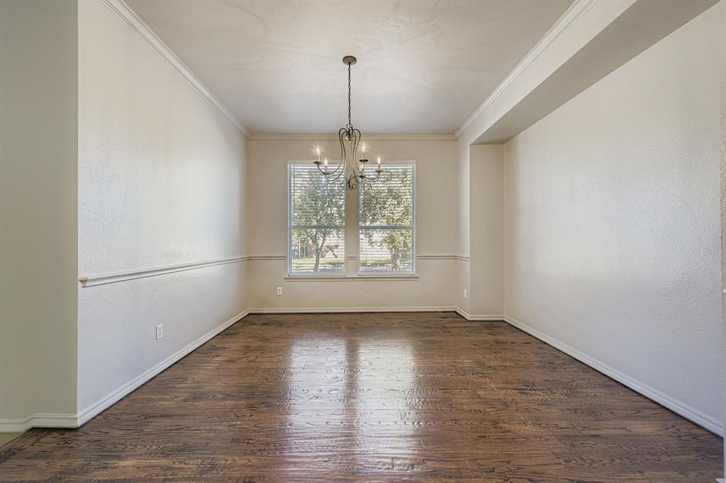 4201 Broken Bend Boulevard Fort Worth, TX 76244 - Photo 8 of 34 wooden floor in an empty room with a window