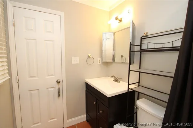 a bathroom with a sink and mirror