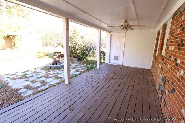 a view of a porch with wooden floor