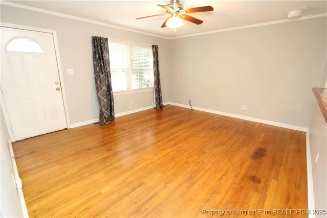 a view of an empty room with a window