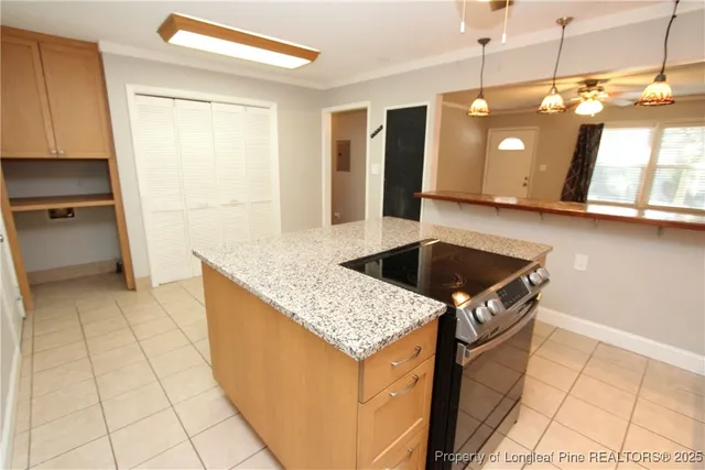 a kitchen with stainless steel appliances granite countertop a sink and a stove
