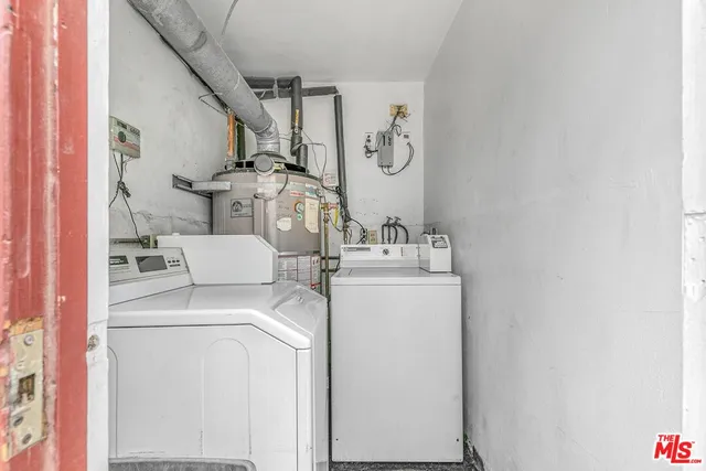 a view of a house with a wooden fence