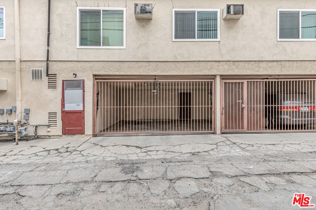 1811 Parnell Avenue, Unit 3 Los Angeles, CA 90025 - Photo 20 of 20 a view of a house with a wooden fence