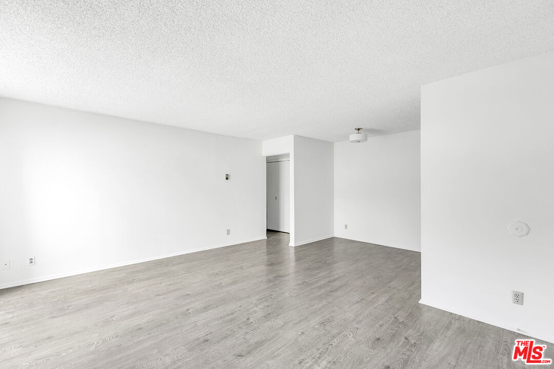 1811 Parnell Avenue, Unit 3 Los Angeles, CA 90025 - Photo 7 of 20 an empty room with wooden floor