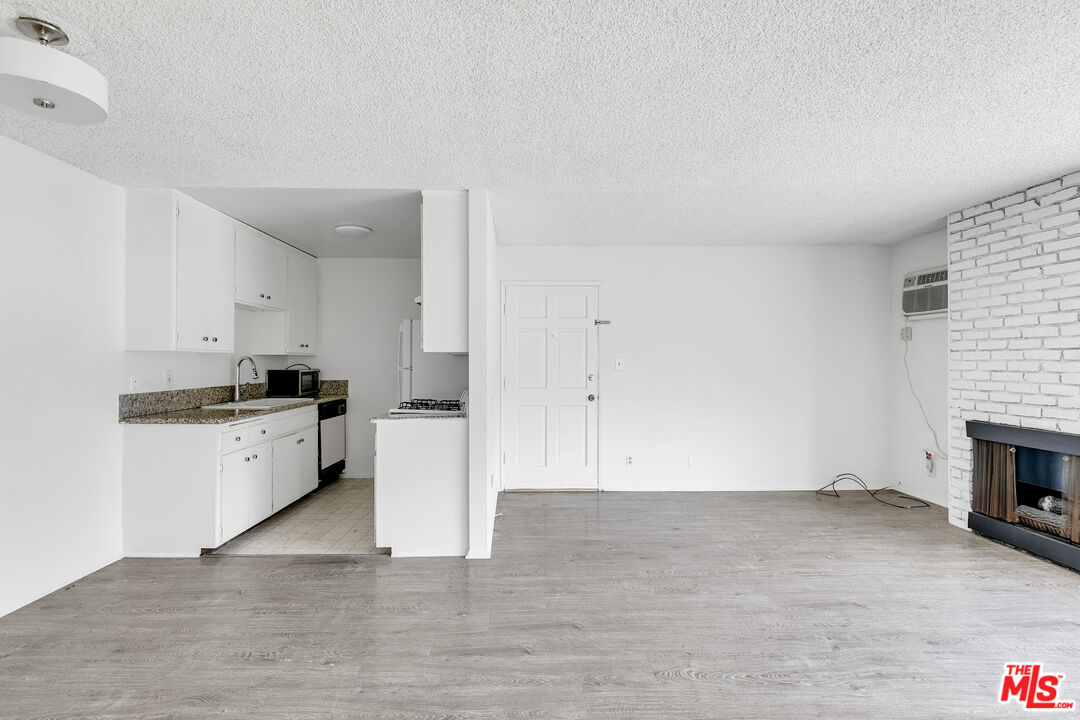 1811 Parnell Avenue, Unit 3 Los Angeles, CA 90025 - Photo 9 of 20 a kitchen with a cabinets and white appliances