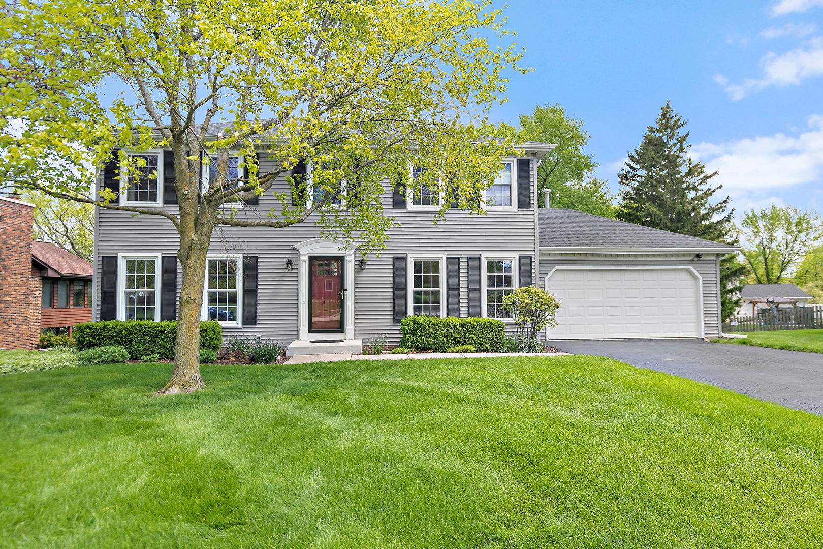 front view of a house with a yard