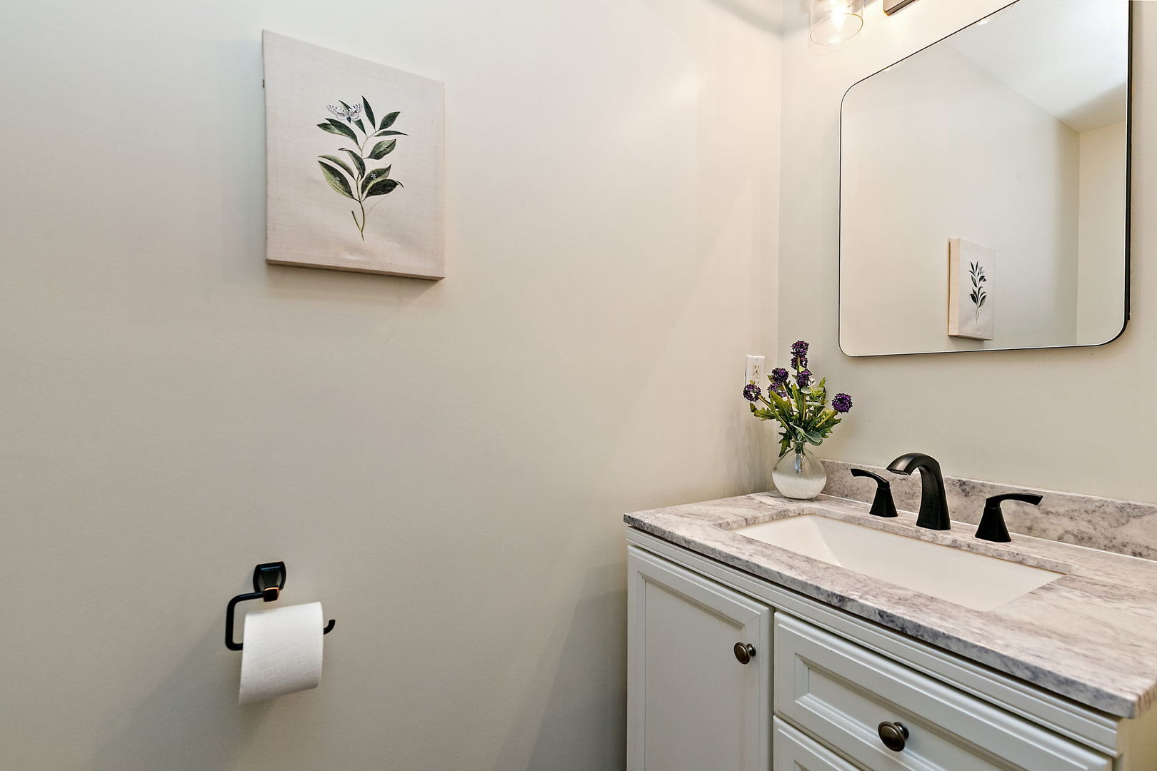18 Jennifer Lane DeKalb, IL 60115 - Photo 14 of 48 a bathroom with a sink and a mirror