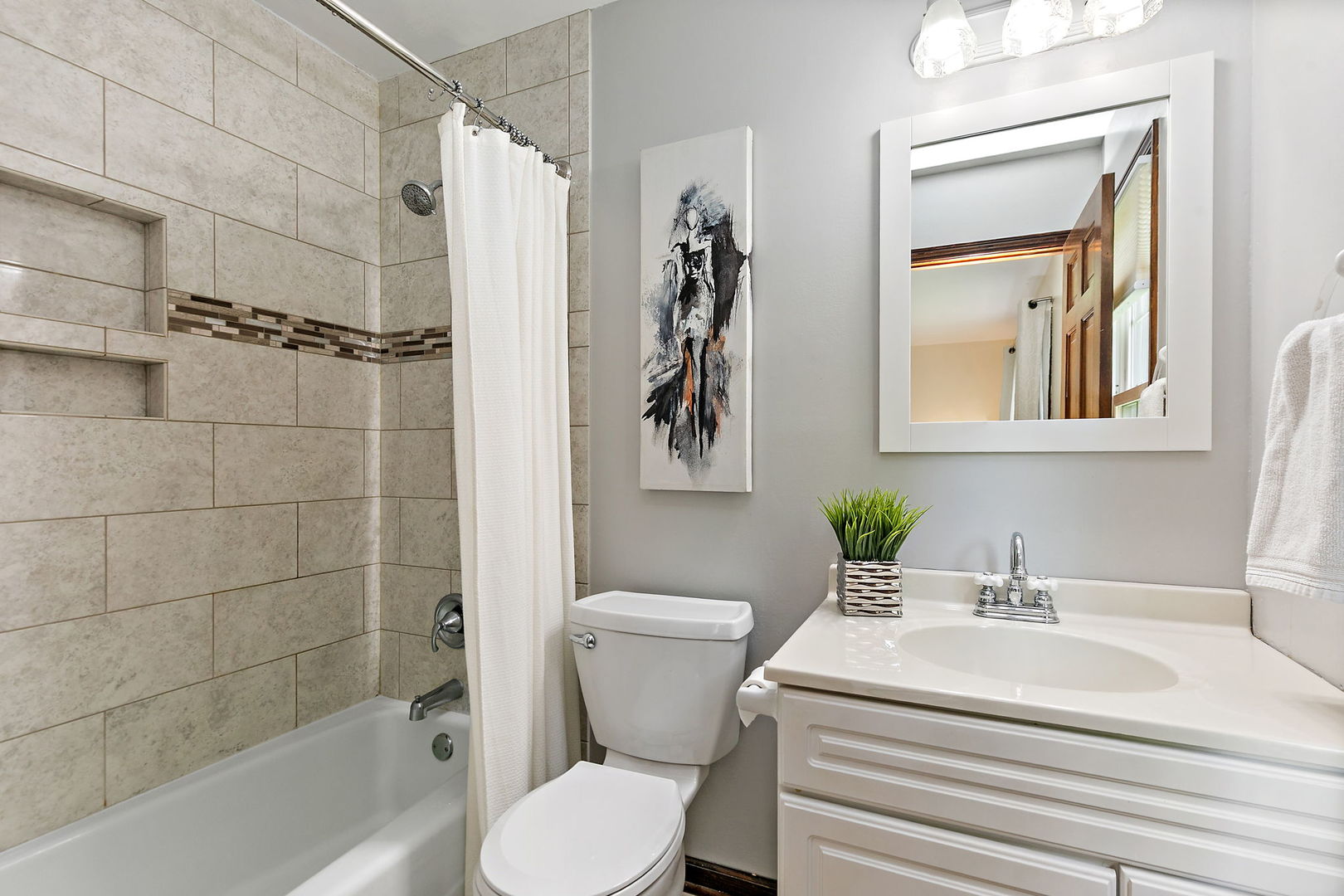 18 Jennifer Lane DeKalb, IL 60115 - Photo 17 of 48 a bathroom with a sink a toilet and shower