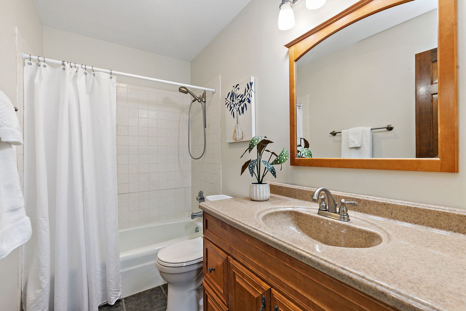 18 Jennifer Lane DeKalb, IL 60115 - Photo 20 of 48 a bathroom with a sink a toilet and shower