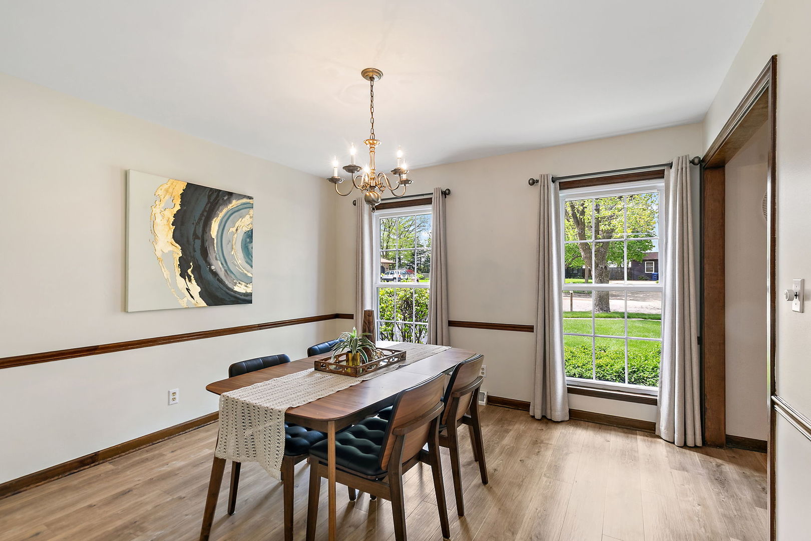 18 Jennifer Lane DeKalb, IL 60115 - Photo 4 of 48 a view of a dining room with furniture window and wooden floor