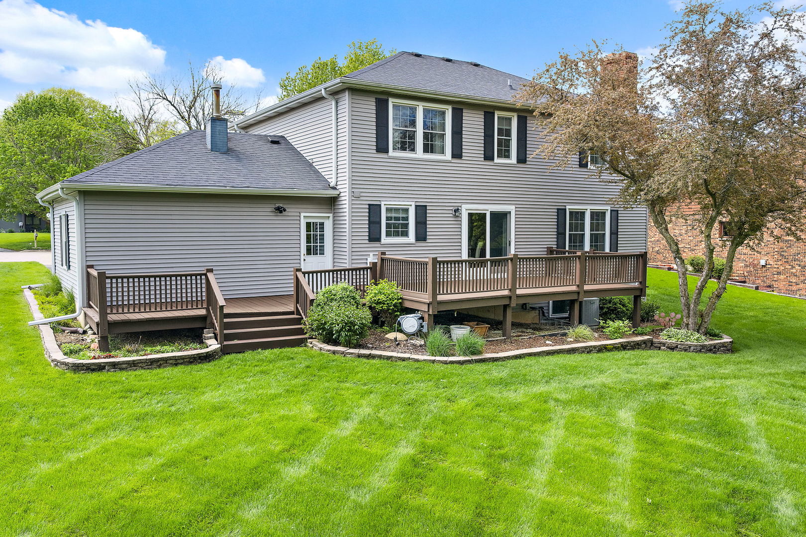 18 Jennifer Lane DeKalb, IL 60115 - Photo 43 of 48 a view of a house with a yard porch and sitting area