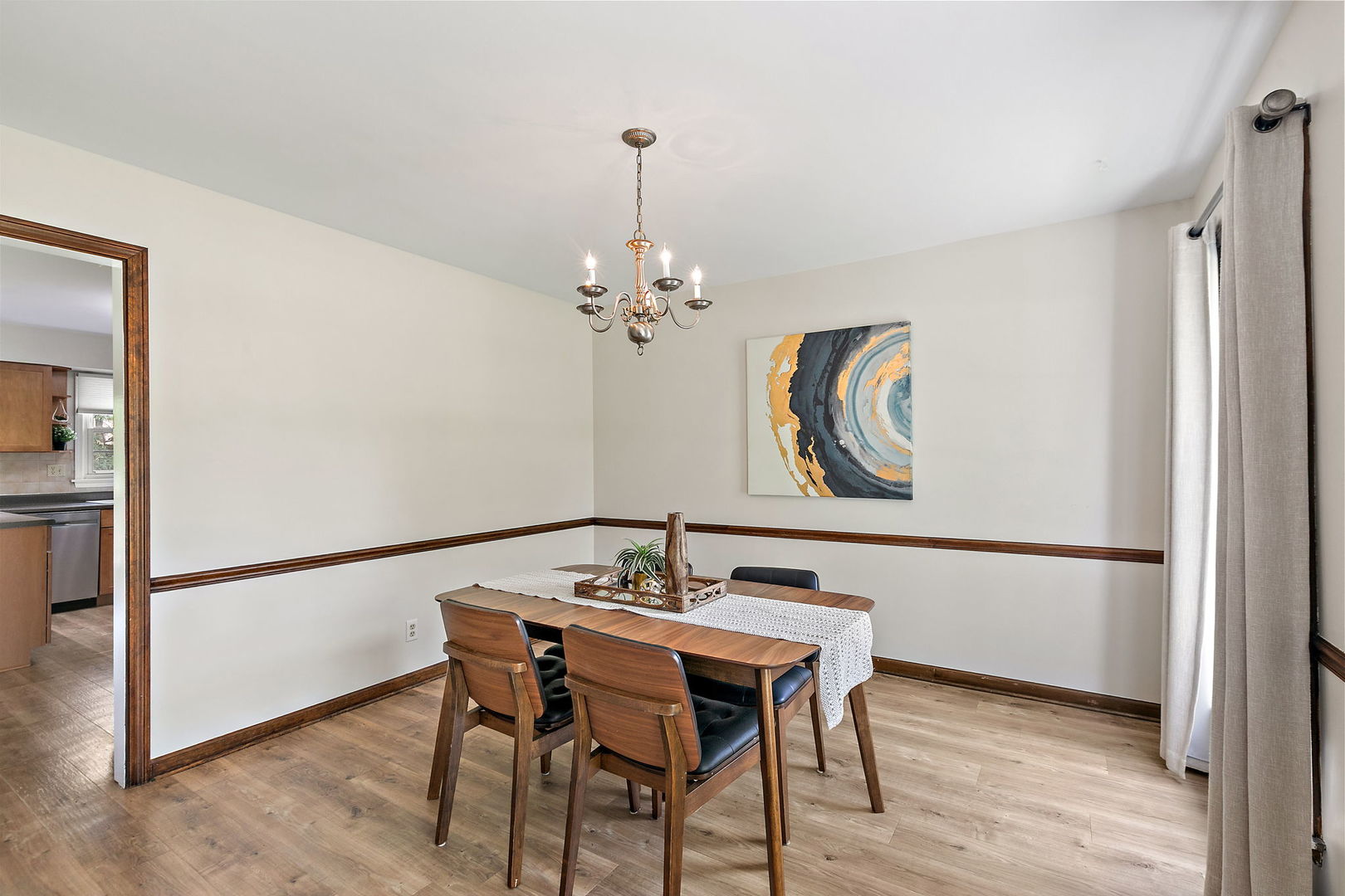 18 Jennifer Lane DeKalb, IL 60115 - Photo 5 of 48 a view of a dining room with furniture and wooden floor