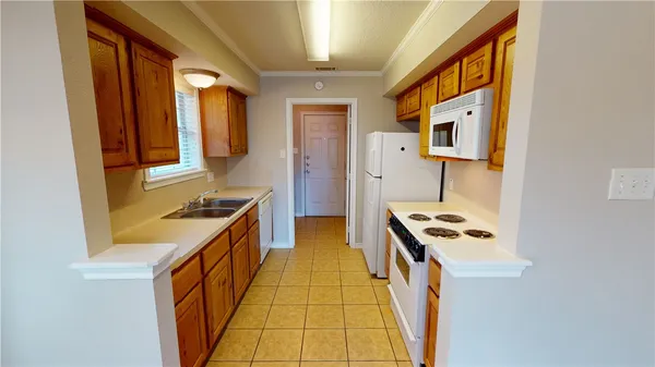 a kitchen with stainless steel appliances granite countertop a stove and a refrigerator