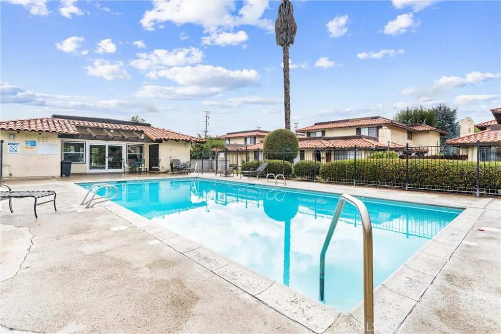 3927 West McFadden Avenue Santa Ana, CA 92704 - Photo 13 of 14 a view of a house with a swimming pool