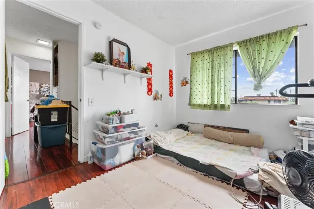 a bedroom with furniture and a window
