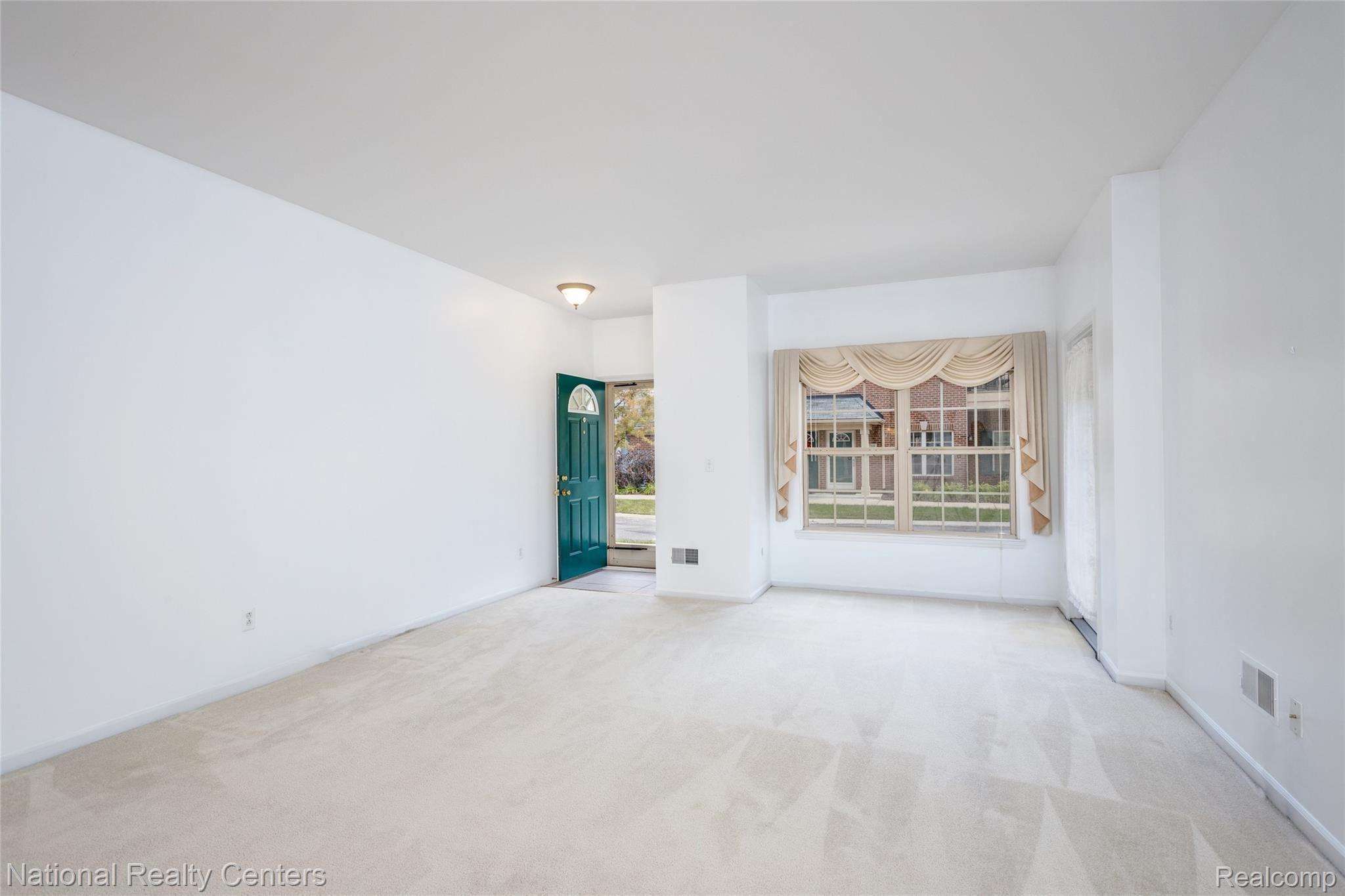 11756 Farmington Road Livonia, MI 48150 - Photo 4 of 24 Large living room with high ceilings