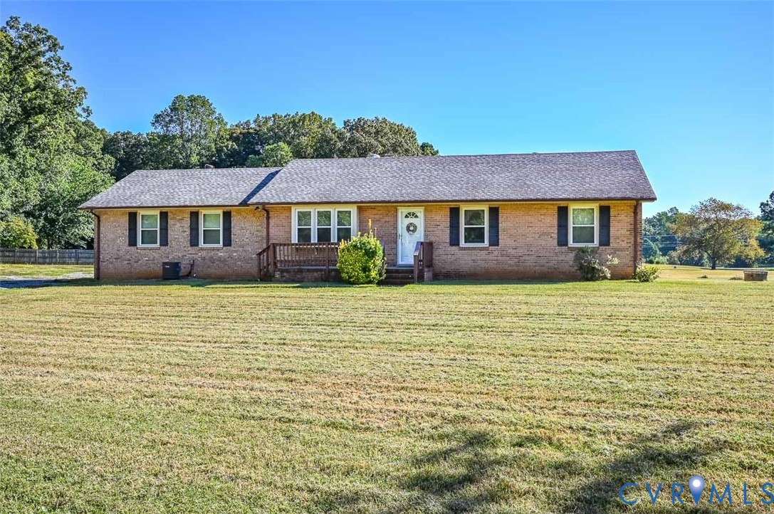 620 Three Chopt Road Manakin-Sabot, VA 23103 - Photo 2 of 42 a front view of a house with a garden