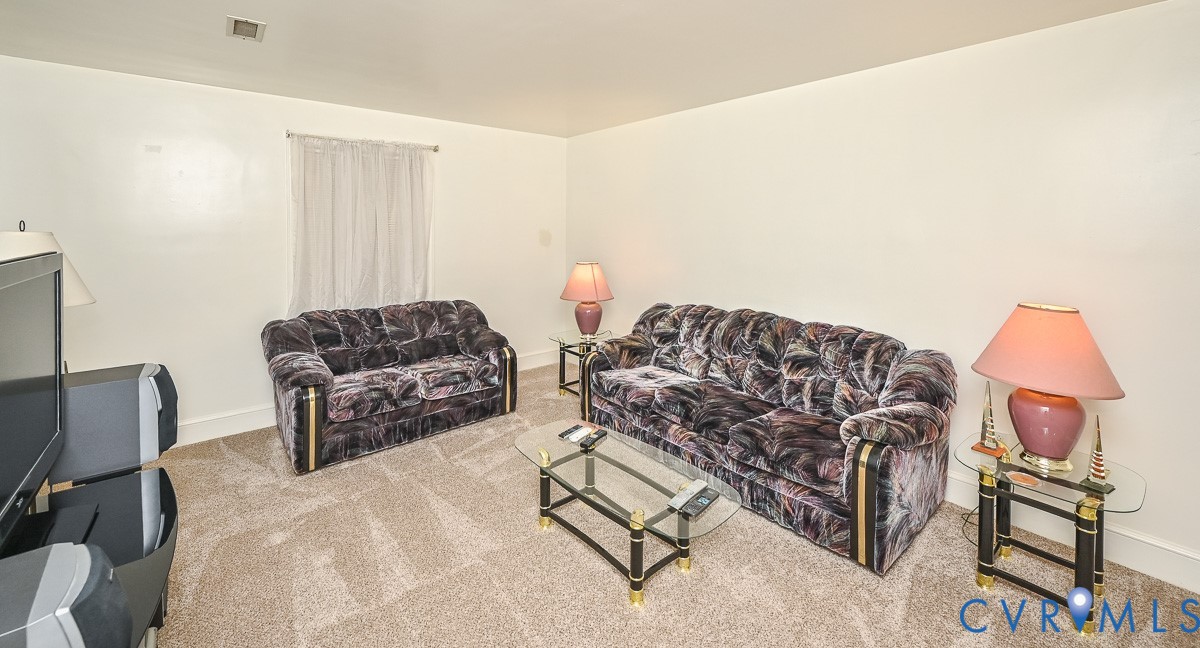 620 Three Chopt Road Manakin-Sabot, VA 23103 - Photo 31 of 42 a living room with furniture a couch and a dresser