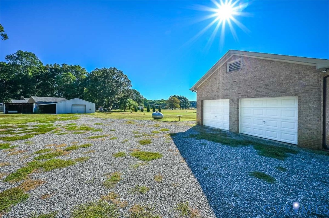 620 Three Chopt Road Manakin-Sabot, VA 23103 - Photo 41 of 42 a view of a backyard with a garden
