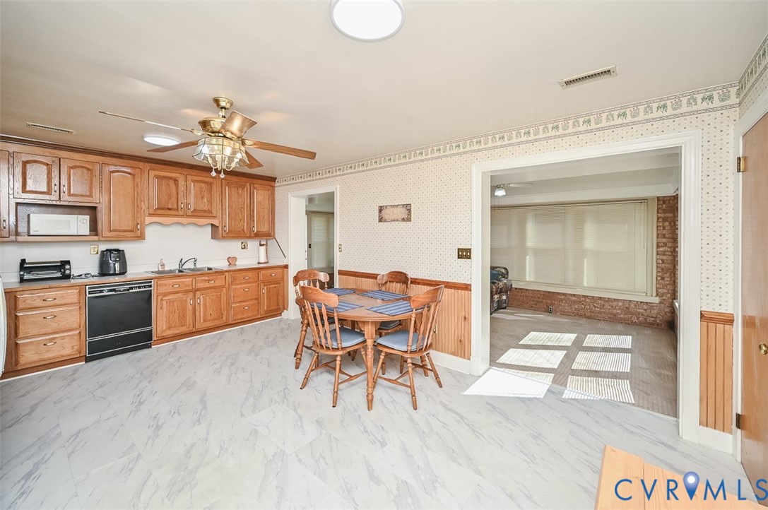620 Three Chopt Road Manakin-Sabot, VA 23103 - Photo 7 of 42 a open kitchen with a table and chairs