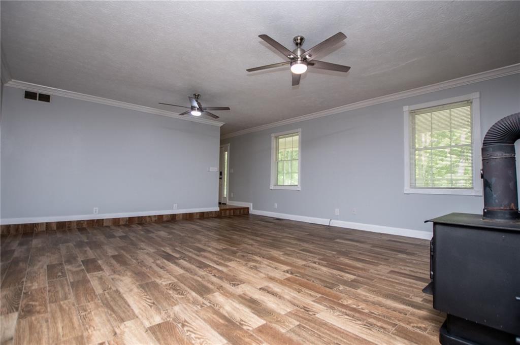 8291 Highway 5 Winston, GA 30187 - Photo 14 of 65 wooden floor in an empty room with a window
