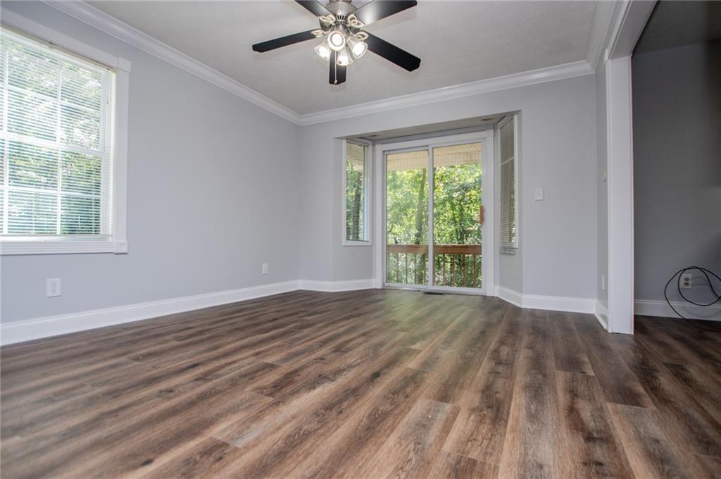 8291 Highway 5 Winston, GA 30187 - Photo 19 of 65 a view of an empty room with wooden floor and a window