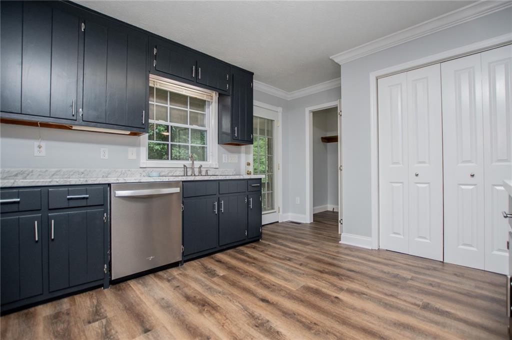 8291 Highway 5 Winston, GA 30187 - Photo 24 of 65 a kitchen with a sink and cabinets