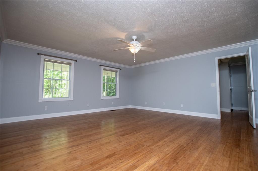 8291 Highway 5 Winston, GA 30187 - Photo 36 of 65 an empty room with wooden floor and windows