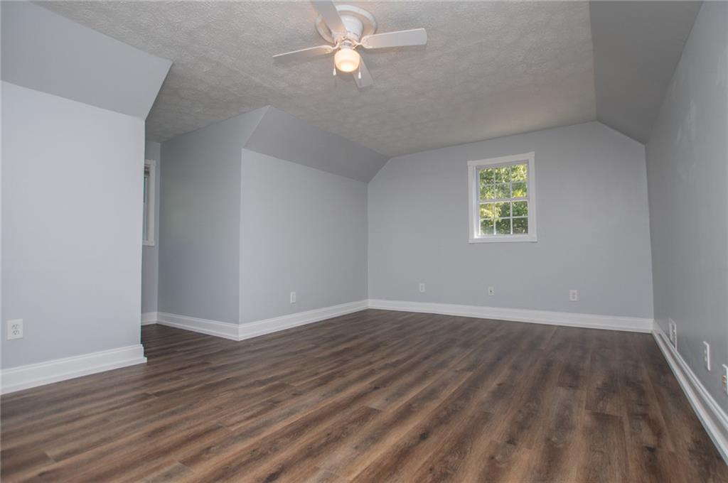 8291 Highway 5 Winston, GA 30187 - Photo 40 of 65 wooden floor in an empty room with a window