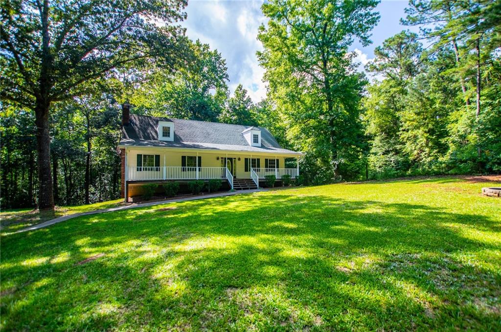 8291 Highway 5 Winston, GA 30187 - Photo 5 of 65 a view of a house with a backyard