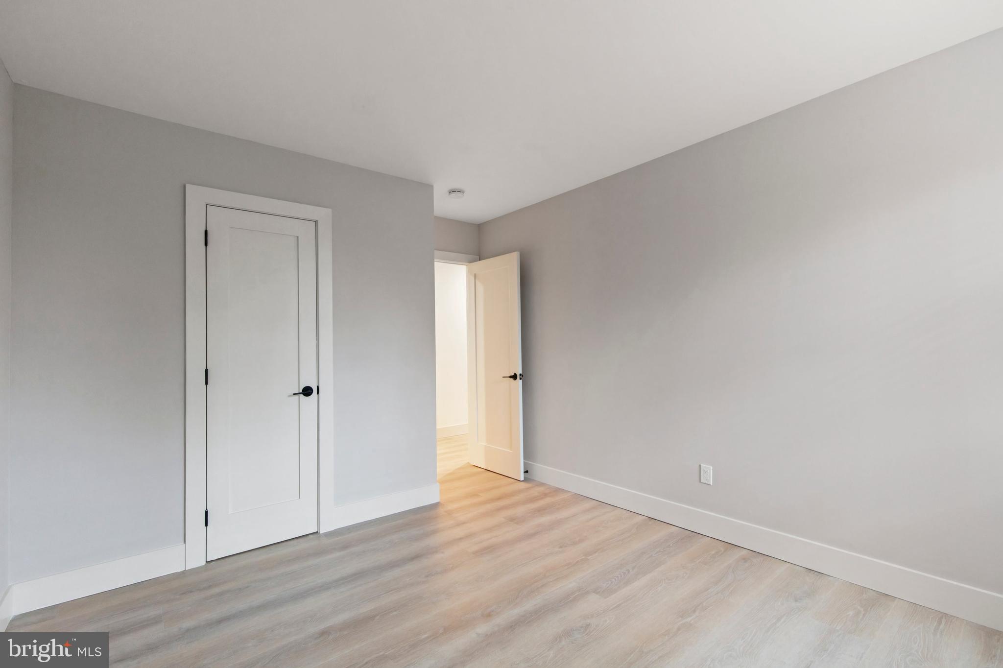 176 West King Street, Unit 311 Malvern, PA 19355 - Photo 6 of 9 a view of an empty room and wooden floor