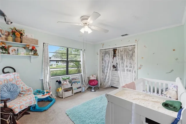 a living room with furniture and white walls