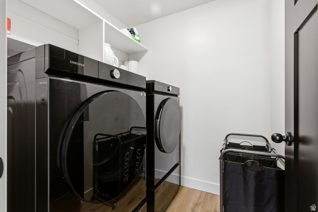 3902 West 825 North West Point, UT 84015 - Photo 12 of 49 Laundry area featuring washer and clothes dryer and light wood-type flooring