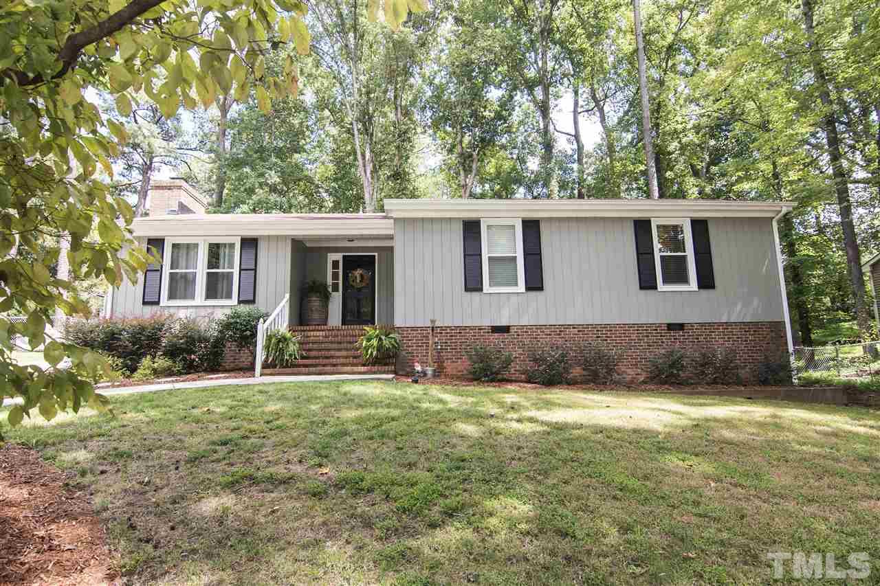 7408 Post Oak Road Raleigh, NC 27615 - Photo 1 of 27 a view of a house with a yard