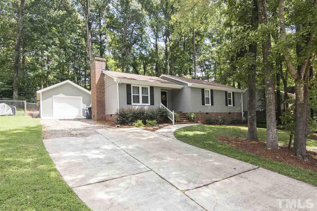 7408 Post Oak Road Raleigh, NC 27615 - Photo 2 of 27 a view of backyard of house with green space