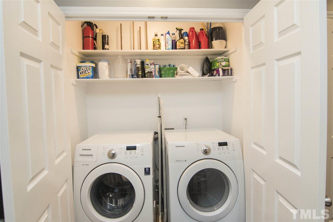 7408 Post Oak Road Raleigh, NC 27615 - Photo 15 of 27 a view of walk in closet with clothes and shoes