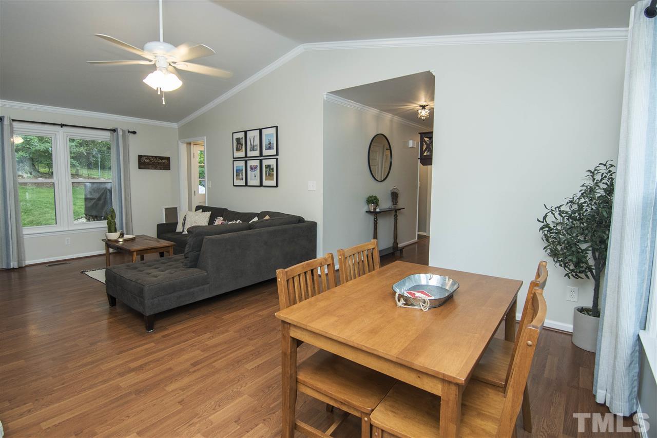 7408 Post Oak Road Raleigh, NC 27615 - Photo 17 of 27 a living room with furniture and a table
