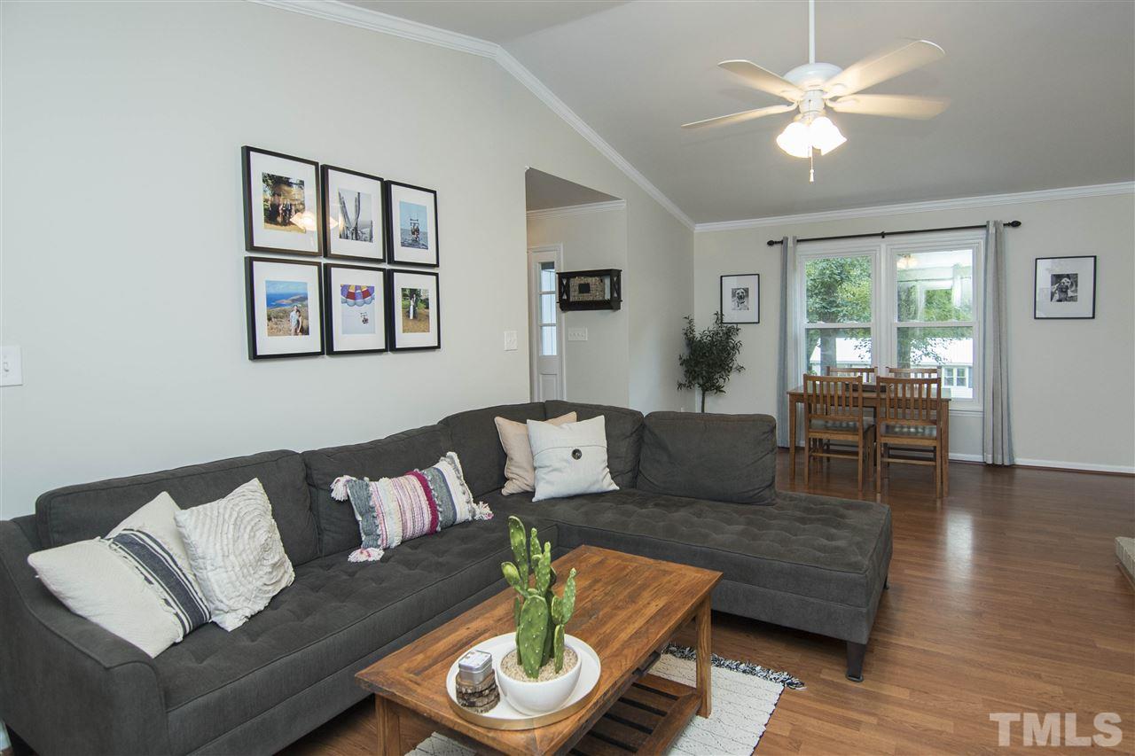 7408 Post Oak Road Raleigh, NC 27615 - Photo 18 of 27 a living room with furniture and a large window