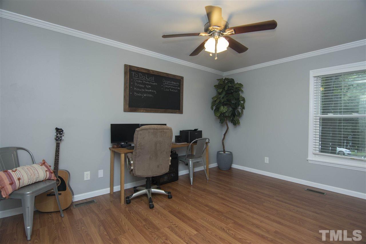7408 Post Oak Road Raleigh, NC 27615 - Photo 20 of 27 a view of a workspace with furniture and a window